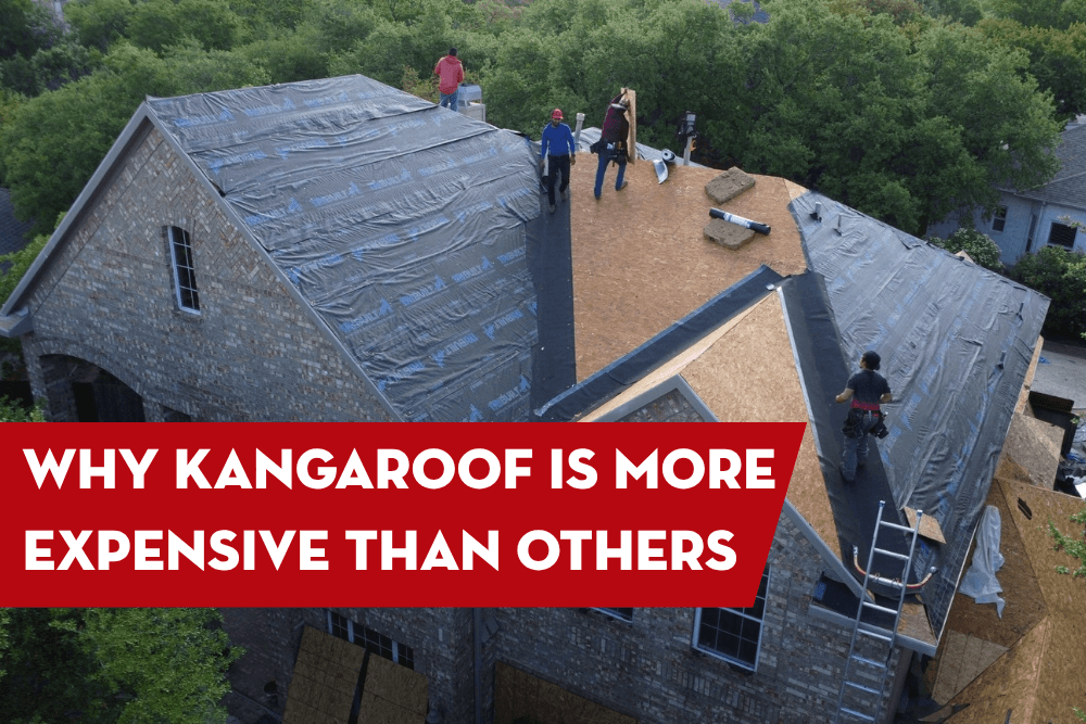 Roof replacement crew installing roof decking and weather protection on a large residential home during a roofing project.